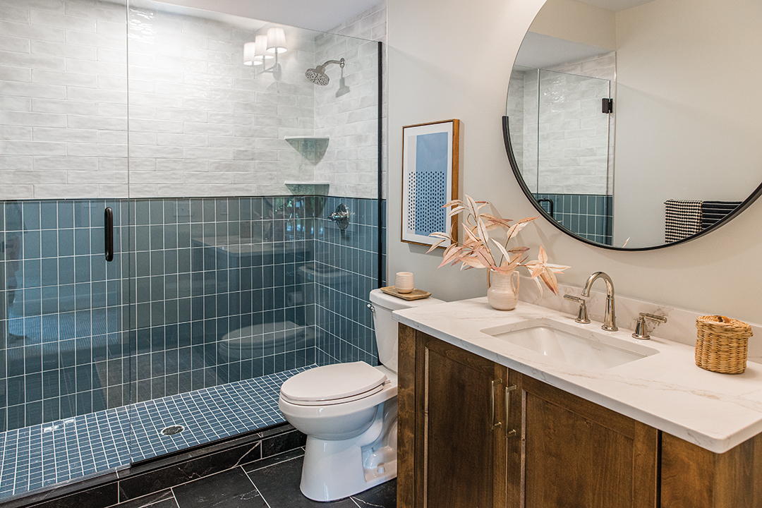 Blue tile adds a pop of character to the bathroom.