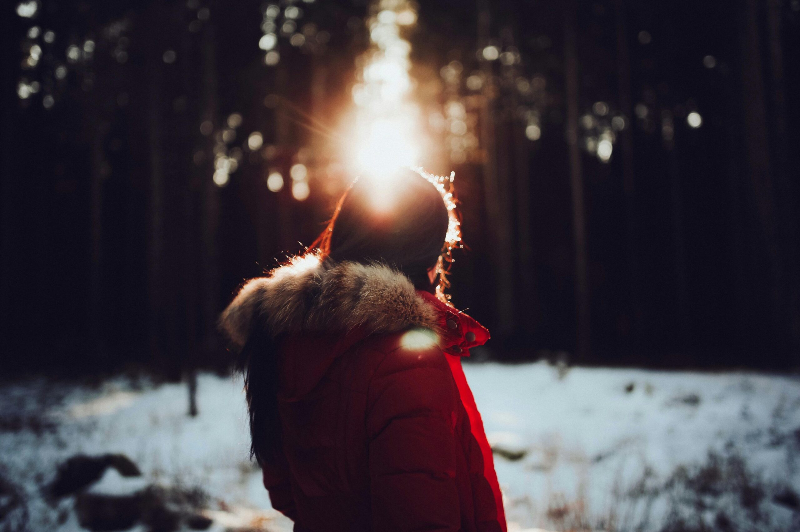 Woman in a red coat during winter.