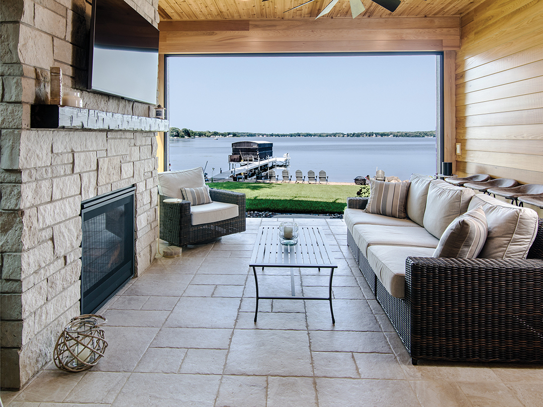 An all-season porch overlooking Spring Lake provides a perfect space for watching a big game or curling up by a fire with a glass of wine.