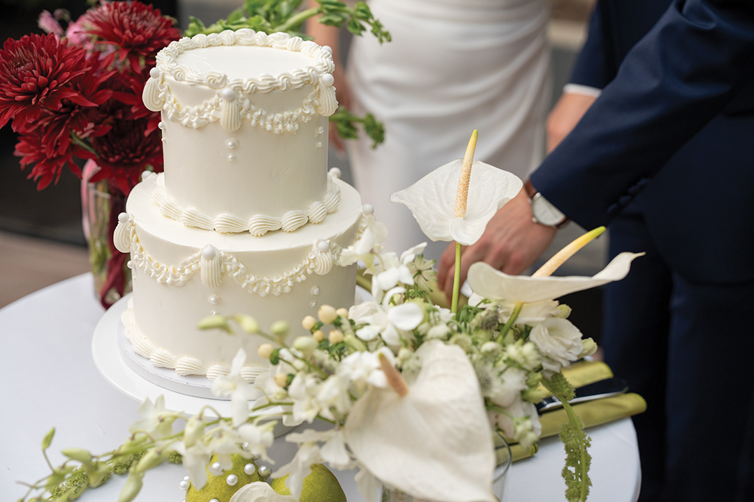 The wedding cake was created by D’Amico & Sons, which also handled catering for the reception dinner.