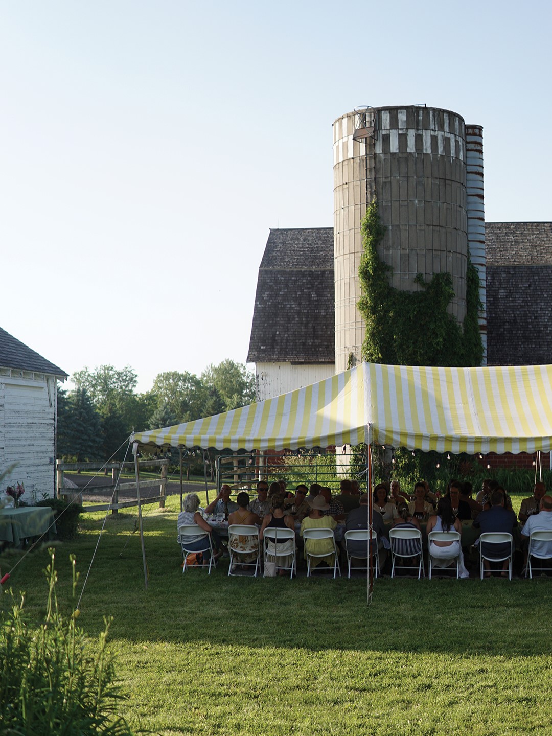 Diners enjoy a multicourse meal prepared by a chef on the grounds of Spring Lake Farm in Prior Lake.