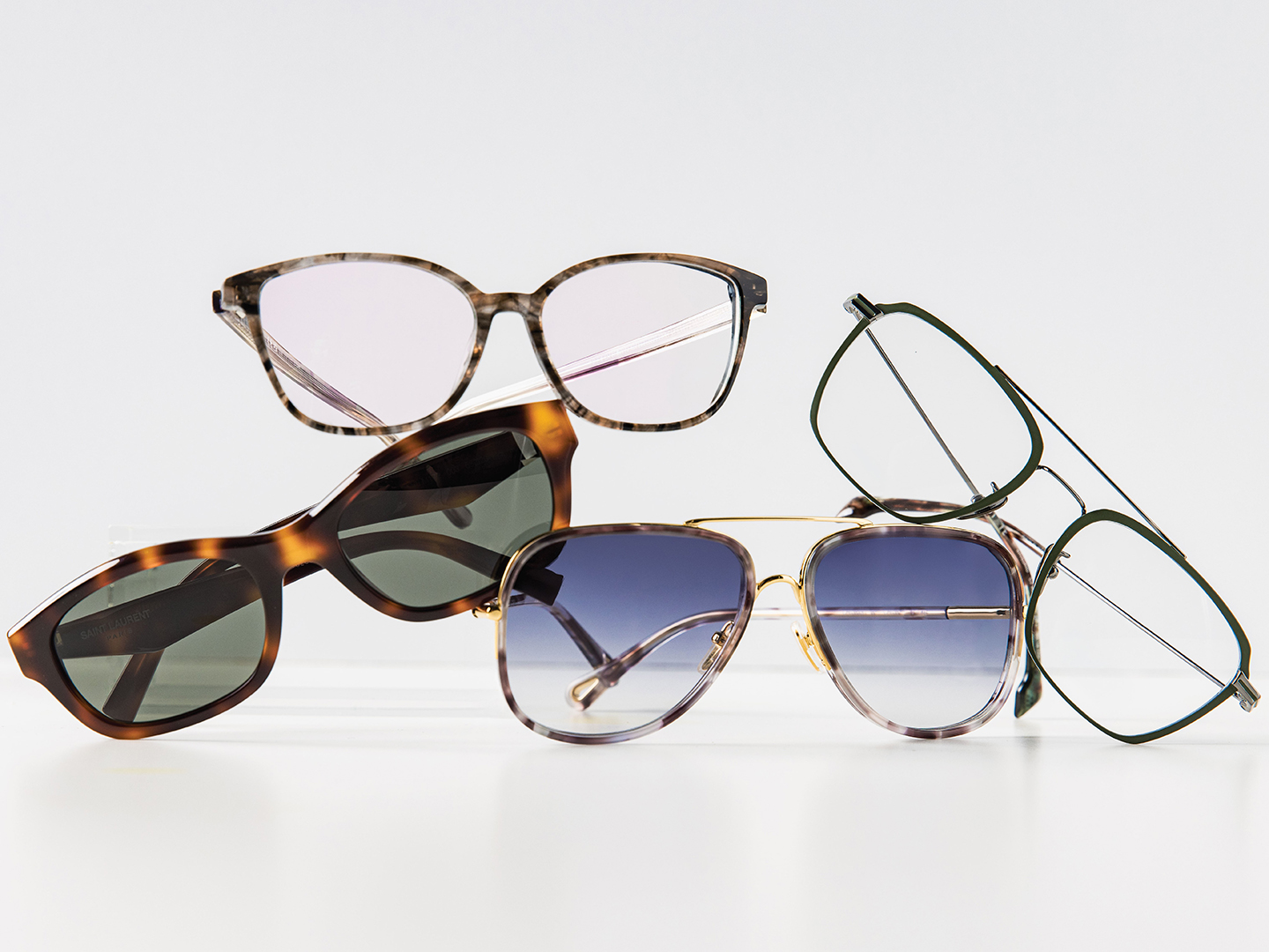 From left to right: Saint Laurent SL M172 ($474) sunglasses embrace ’90s style; Find a modern take on the classic tortoise shell with NW77th Mod 1074 ($240); The Chloe CH0382S ($456) incorporates two trends—aviators and the double bar—in one pair 
of sunglasses; STATE Optical Co.’s Waveland ($348) uses titanium material to create a very lightweight aviator with a double bar.