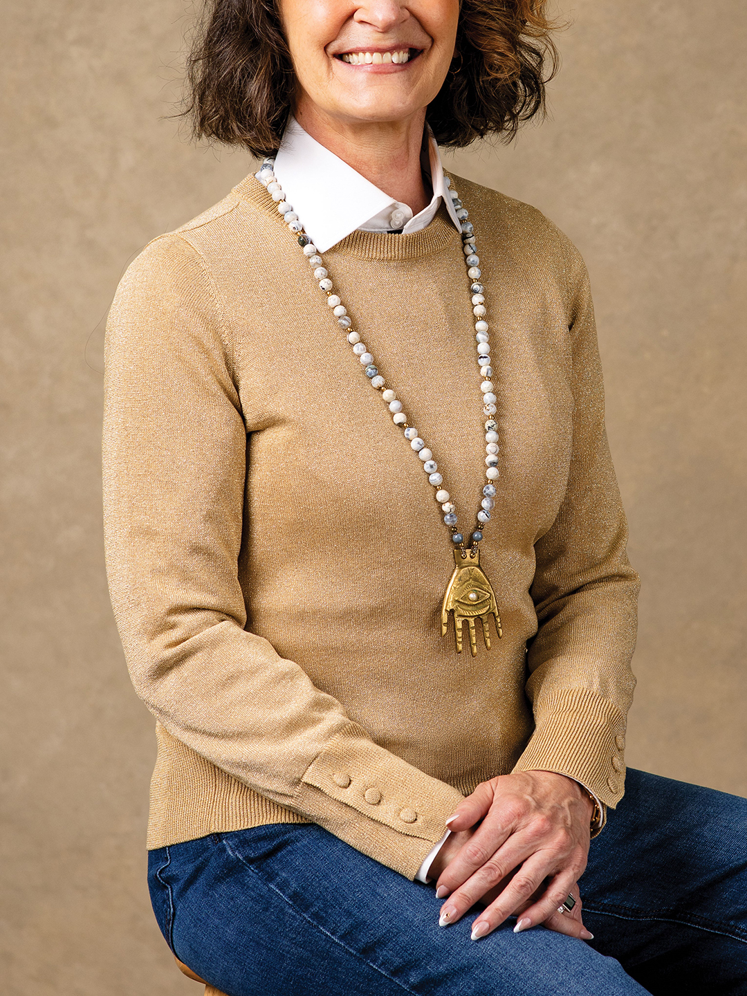 Weekend Style (left): Run a few errands without worrying about who sees you while you’re out and about. Denise McBride’s gold knit crewneck, which came without tags from a consignment store, is paired with a necklace from Fallon Art Advisory ( @fallon.art.advisory) and Neems bespoke dark denim straight leg stretch high rise jeans ($229). The white button-down from J. Hilburn continues to prove its worth.