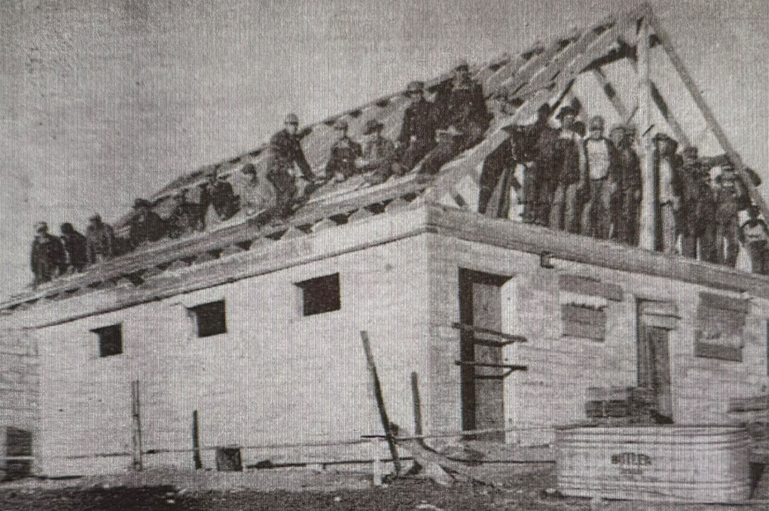 Farmers come together to fix storm damage in October 1949.
